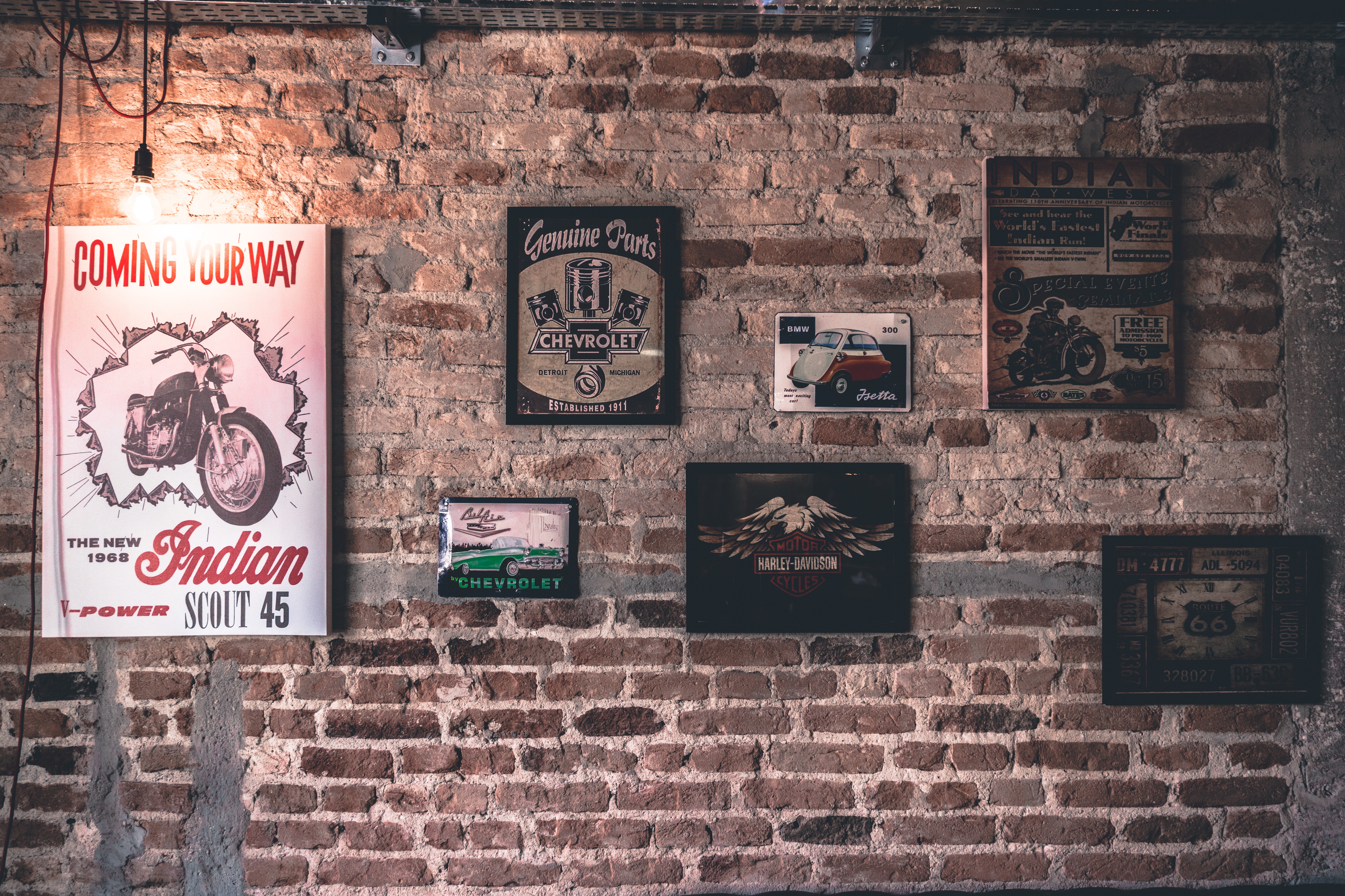 vintage posters on brick wall